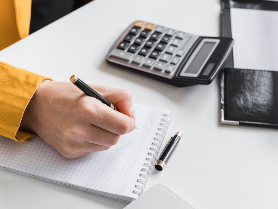 calculator, balance sheet, accountant at desk