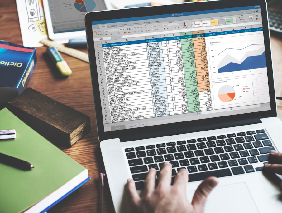 calculator, balance sheet, accountant at desk